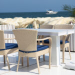 Dining,Table,And,Chairs,On,The,Beach,On,A,Summer